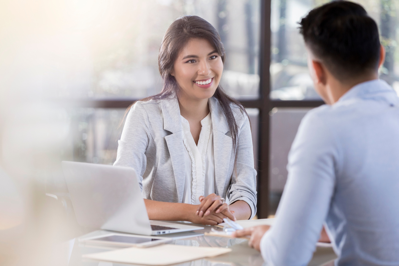 Young associates plan during a face to face meeting